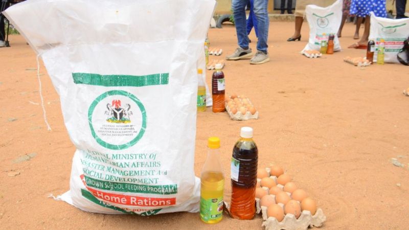 A crate of egg, a bottle of palm oil and a bag of rice