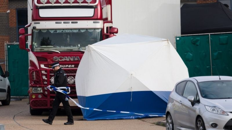 Officers inspect a lorry in Essex after finding 39 bodies inside