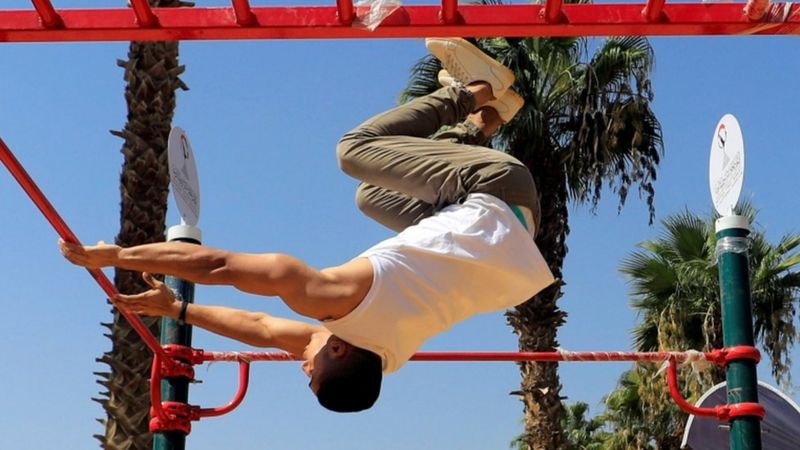 A member of the KO Squad team exercises at the first "Open Gym" opened as a part of the initiative "Be Fit - Be Sports" organized by the Egyptian Street Workout and Calisthenics Federation at the Children"s Garden in the Cairo suburb of Nasr City, Egypt, September 29, 2020.