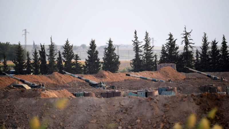 Artillery pieces on the Turkish side of the border with Syria near Akcakale in Sanliurfa province on 8 October