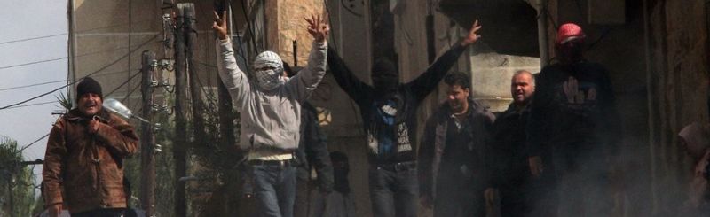 Anti-government protesters on the streets of the Syrian city of Deraa on 23 March 2011