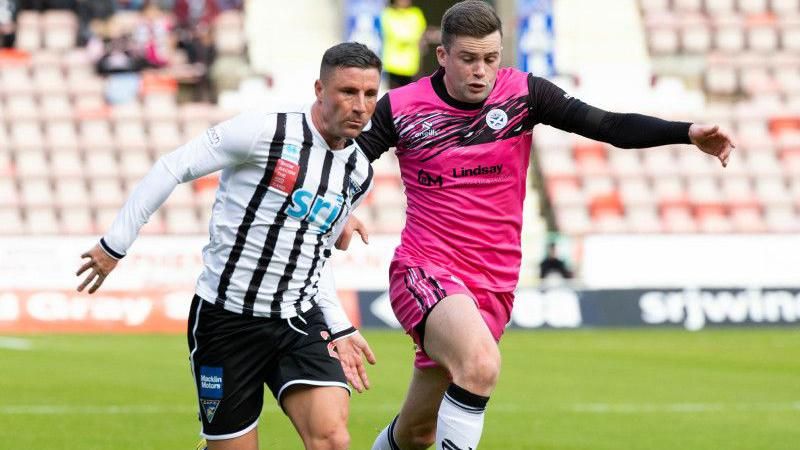 Dunfermline's Michael O'Halloran and Ayr United's Anton Dowds in action during a cinch Championship match between Dunfermline Athletic and Ayr United at KDM Group at East End Park
