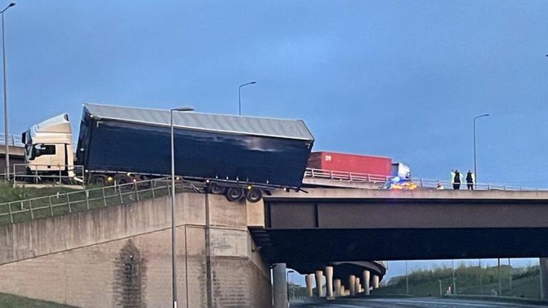 M1 Crash Leaves Lorry Hanging Off Bridge - BBC News