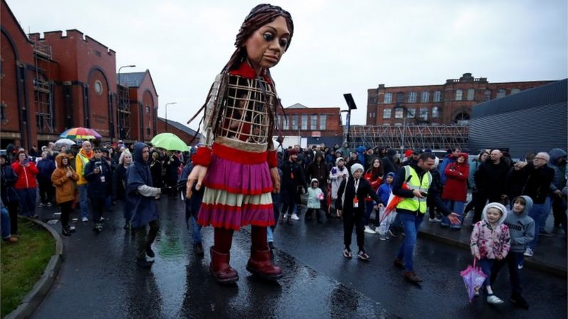 Little Amal: Wigan welcomes giant refugee puppet to town - BBC News