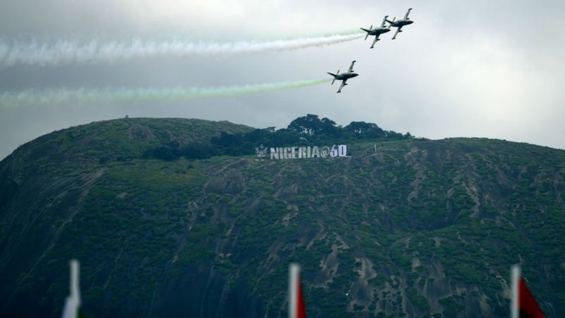Nigerian Airforce Planes fly past a Nigerian 60th anniversary banner at the Aso-Rock in Abuja, Nigeria during the countrys 60th Independence Celebration on October 1, 2020.