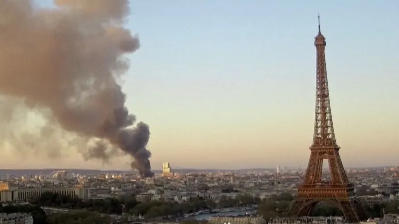Plume of smoke in Paris skyline, Eiffel Tower on right side