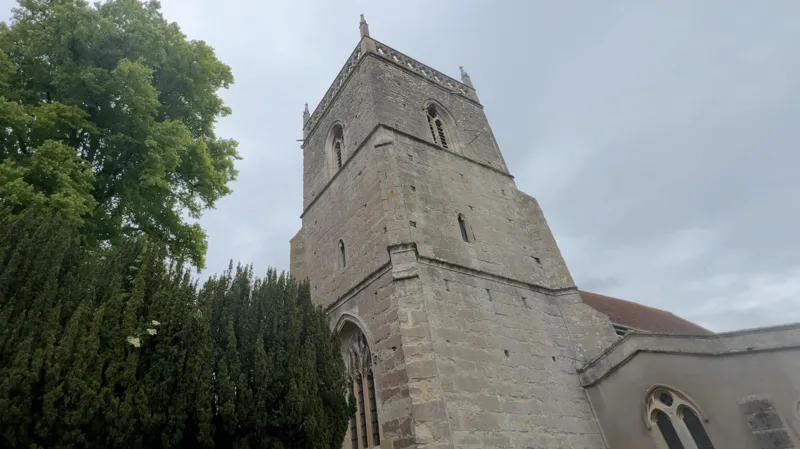 The outside of St Augustine's church tower showing no evidence of the clock inside which has neither hands nor a face.