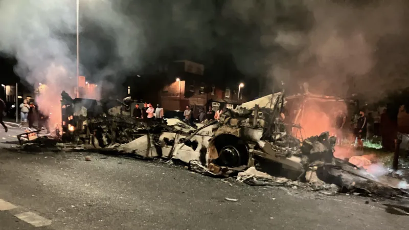 Bus destroyed and police car flipped in Leeds disorder