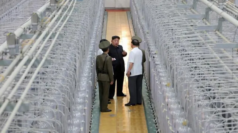 N Korea releases rare photos of Kim at uranium facility