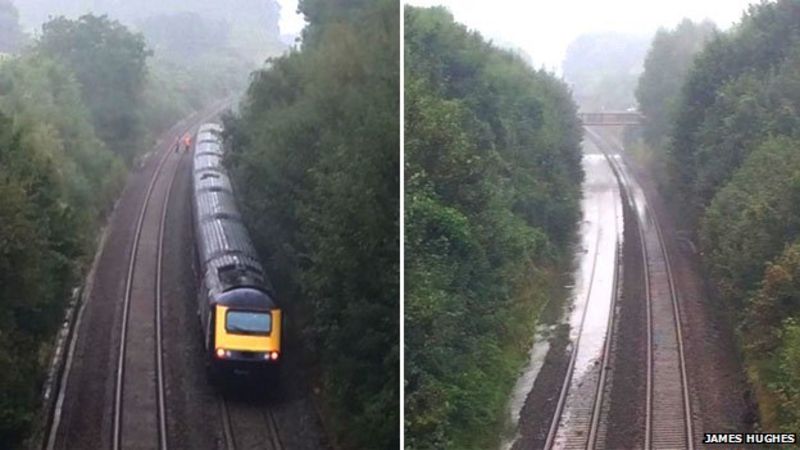 Train Stuck In Flood Water After Storms In Southern England - BBC News