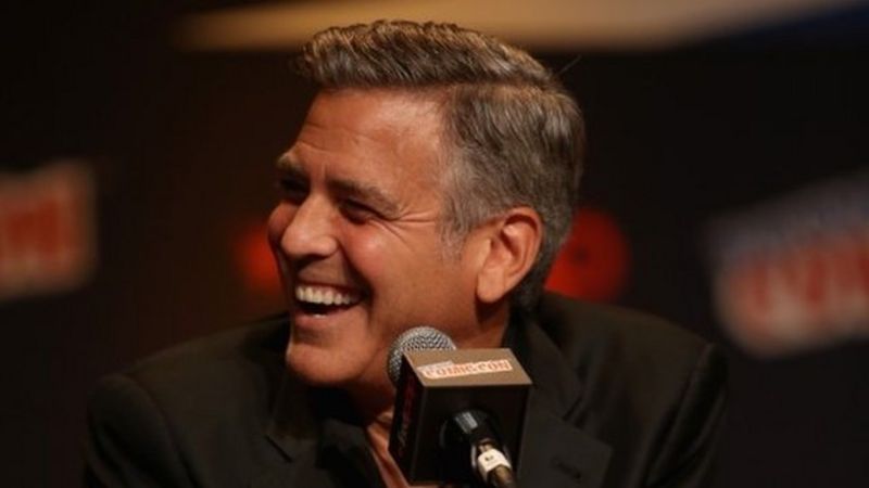 George Clooney surprises 87-year-old fan with birthday flowers - BBC News