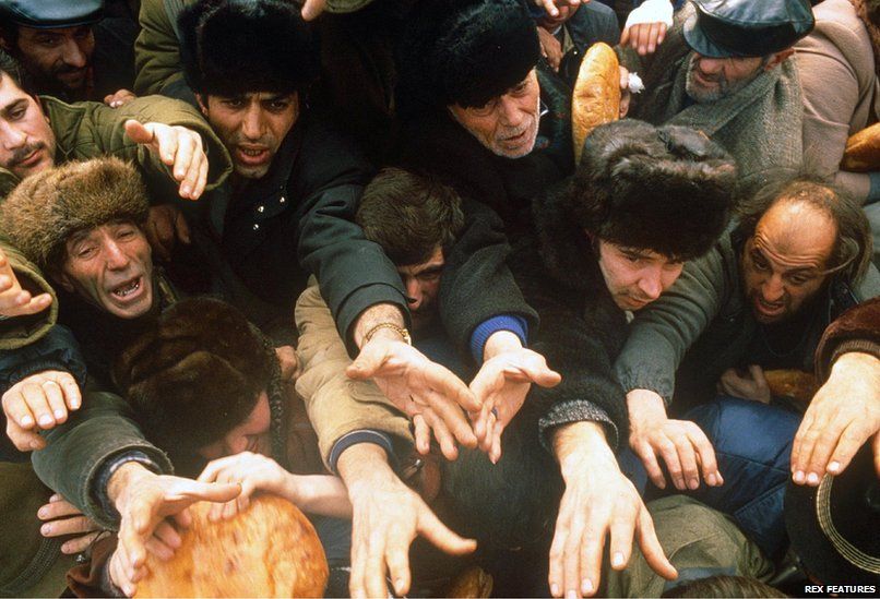 Bread is distributed to survivors after an earthquake hit Armenia, on December 7, 1988.