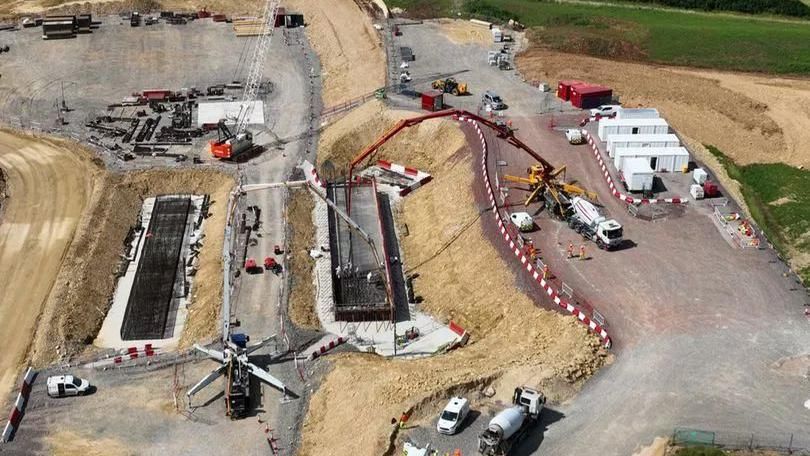 Construction work on the Missing Link scheme in Gloucestershire. Several construction vehicles and machines can be seen. 