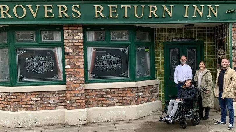 Rob and Lindsey Burrow with actors Daniel Brocklebank and Peter Ash on the Coronation Street set