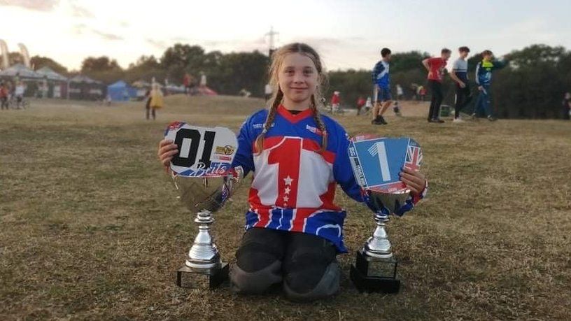 Amelie Eaton posing with her trophies