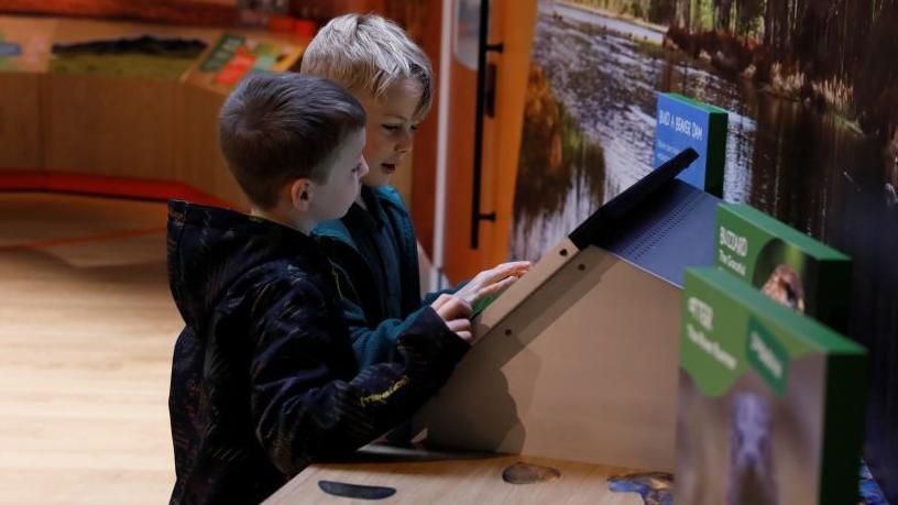 Two boys inside Scotland's Wildlife Discovery Centre 