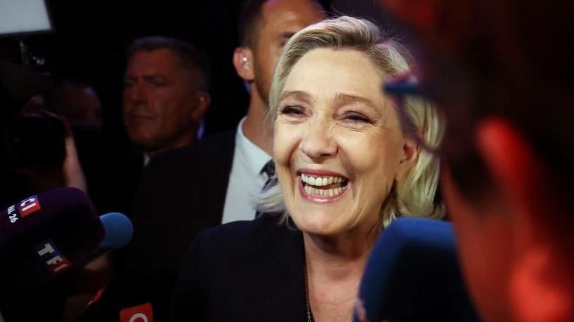 Marine Le Pen, French far-right leader and far-right Rassemblement National (National Rally - RN) party candidate, speaks to journalists after partial results in the first round of the early French parliamentary elections in Henin-Beaumont, France, June 30, 2024