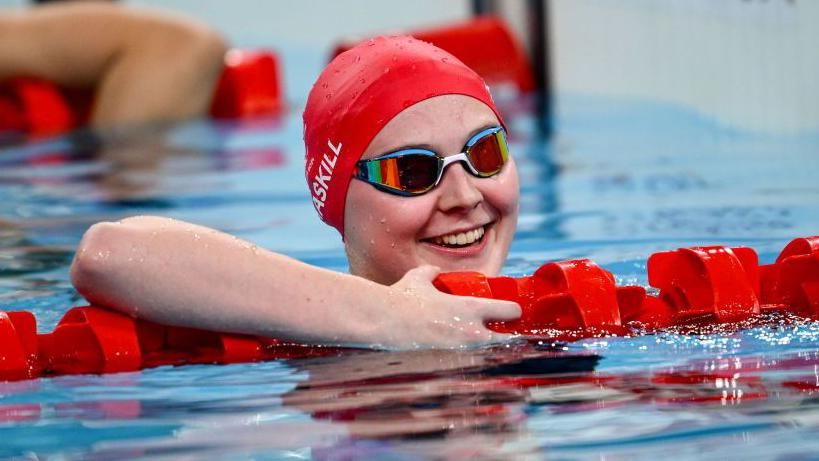 Poppy Maskill smiles after her race