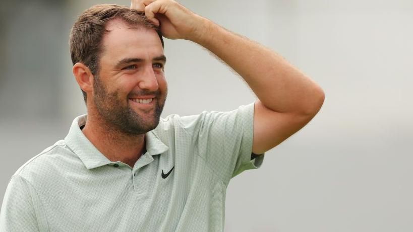 Scottie Scheffler smiles after winning the Tour Championship