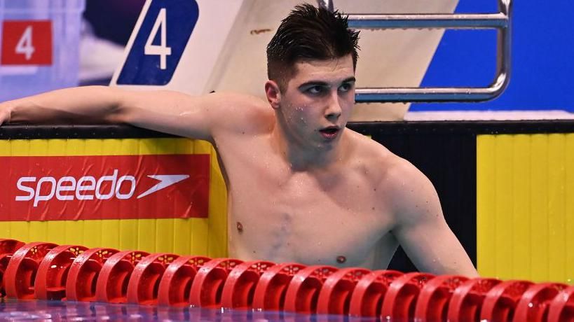 Para-swimmer William Ellard in the pool at the end of a race