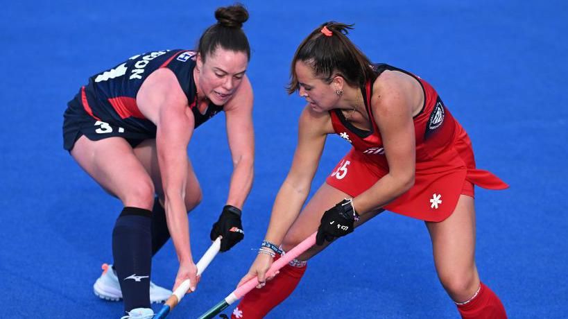 Sanne Caarls of the United States is tackled by Grace Balsdon of Great Britain during the FIH Pro League Women's match between USA and Great Britain