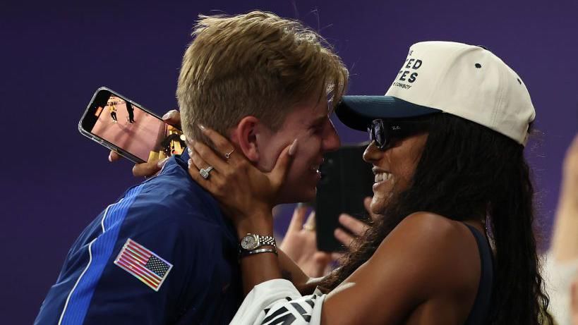 Hunter Woodhall hugging his woman  Tara-Davis Woodhall aft  winning Paralympic gold