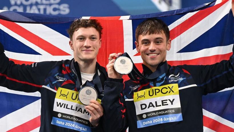 Noah Williams and Tom Daley celebrate with world silver medals