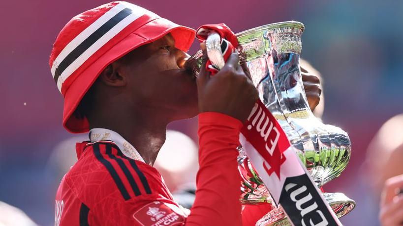 Player of the match Kobbie Mainoo celebrates with the FA Cup after Manchester United's Wembley win