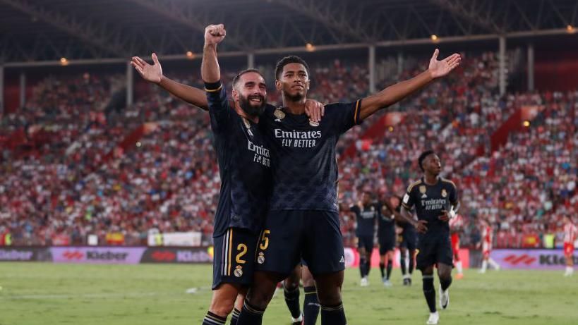 Real Madrid players Dani Carvajal and Jude Bellingham celebrate a goal 