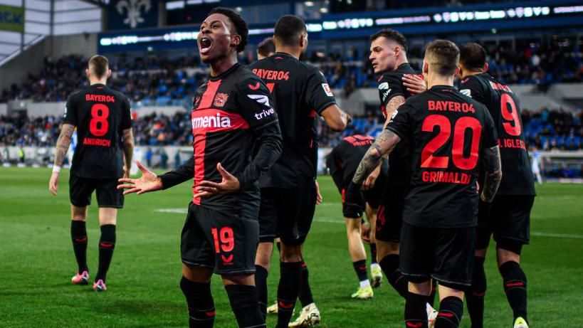 Nathan Tella celebrates scoring for Leverkusen