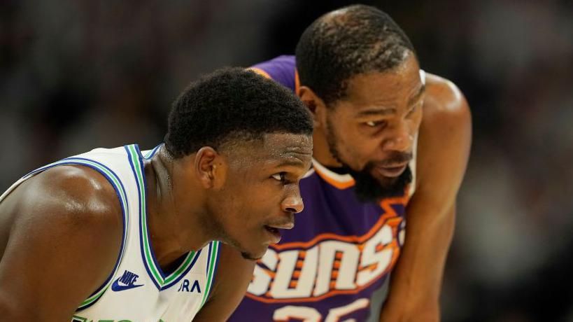 Minnesota Timberwolves' Anthony Edwards in discussion with Phoenix Suns' Kevin Durant