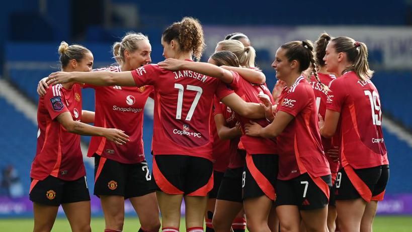 Manchester United celebrate after Grace Clinton scored against Brighton & Hove Albion in the WSL.