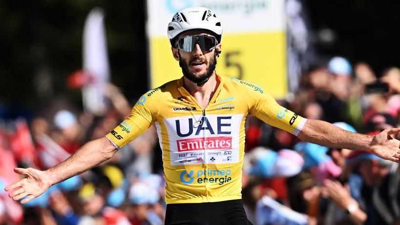 Adam Yates celebrates winning stage five at the Tour de Suisse