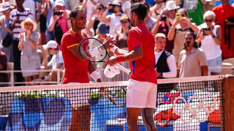 Rafael Nadal and Novak Djokovic shake hands at the net