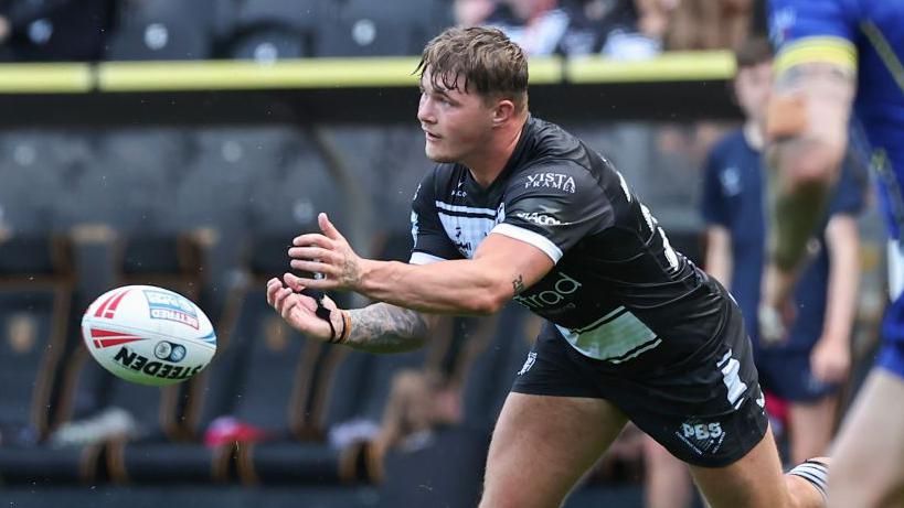 Hull FC's Denive Balmforth passes the ball during the Betfred Super League match between Hull FC and Warrington Wolves at MKM Stadium on June 22, 2024 in Hull, England