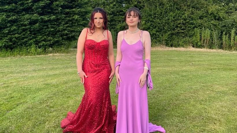 Lucy and Amelia in a red and pink dress at their prom