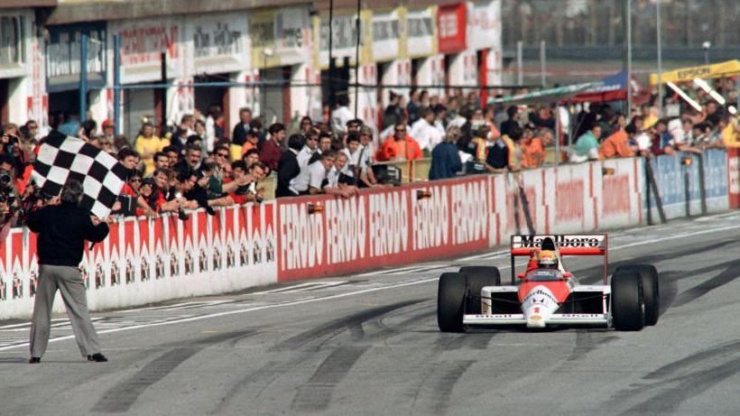 Ayrton Senna crossing the line to win in 1989 at Imola