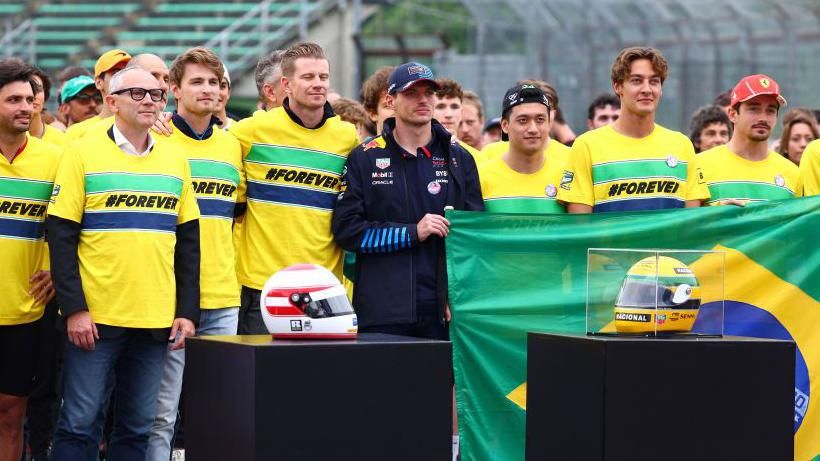 Formula 1 drivers lining up to celebrate Ayrton Senna and Roland Ratzenberger at Imola