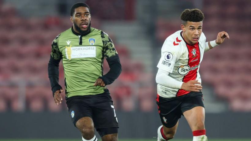 Jayden Fevrier of Colchester United and Josh Squires of Southampton B during the Premier League Cup match
