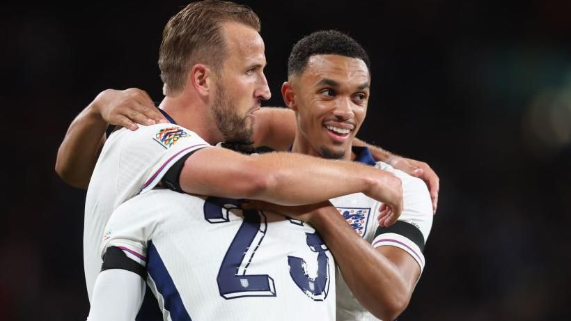 Trent Alexander-Arnold congratulates Harry Kane after he set up the England captain's first goal against Finland