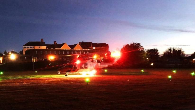 Helicopter landing at night at army reserve centre in Dorchester