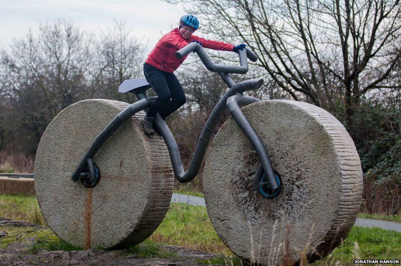 Cyclist on stone sculpture