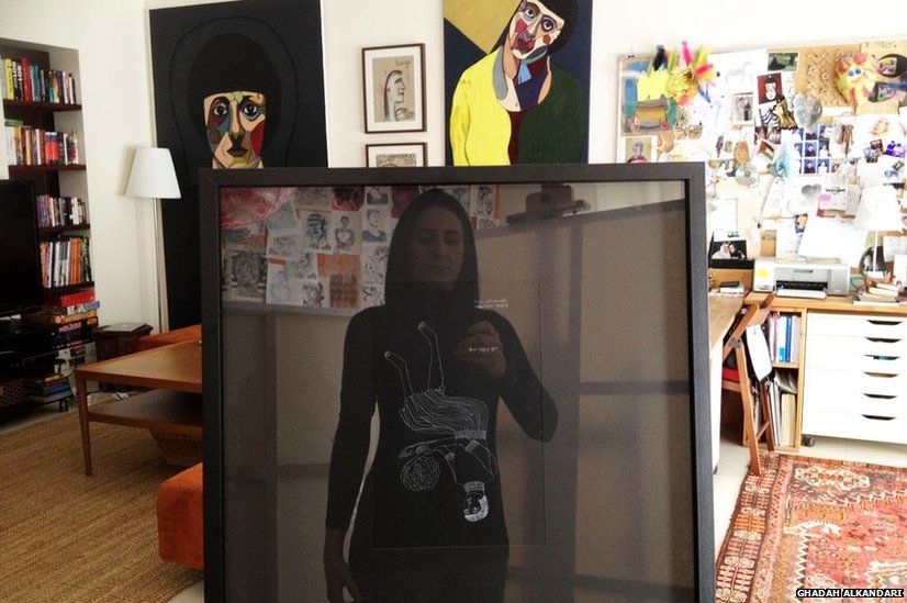 Woman reflected in picture frame