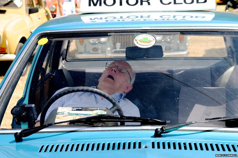 Man sleeping in car
