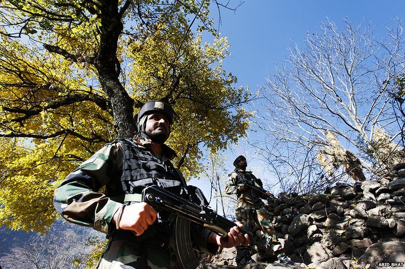 Indian Army soldiers stand guard near the Line of Control in Uri, some 125 km north of Srinagar.