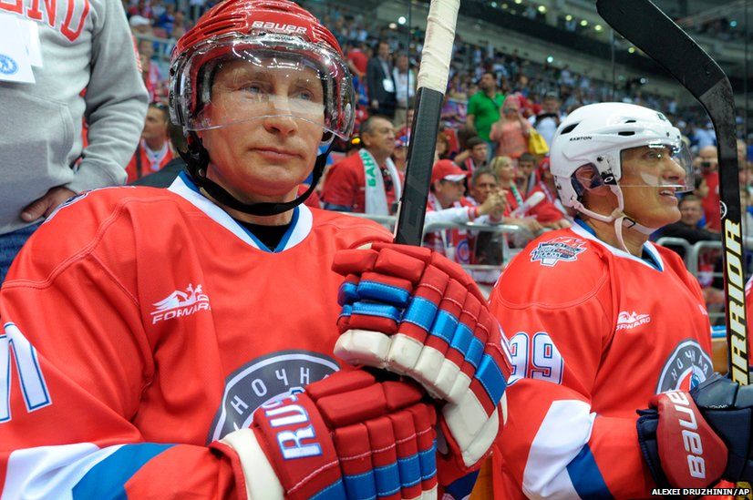 Russian President Vladimir Putin takes part in an ice hockey match in Sochi