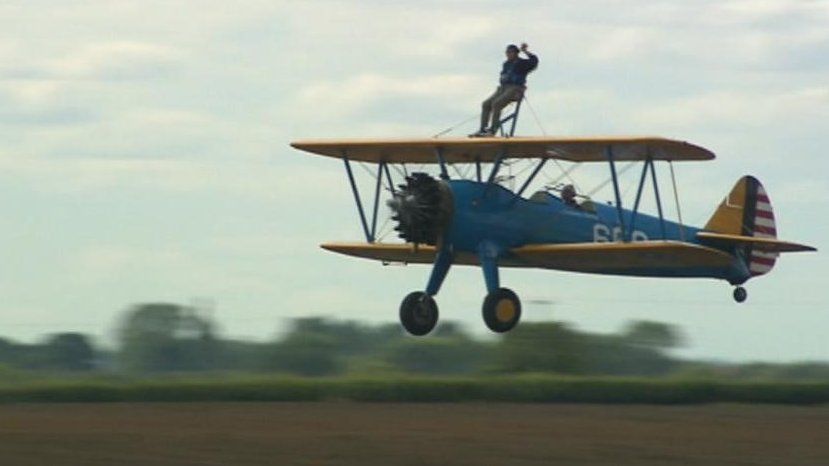 John Weston on a biplane