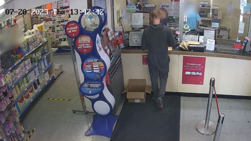 CCTV showing Donatas Kasputis at a Post Office counter