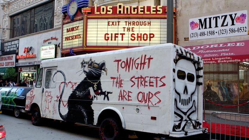 Large rat mural advertising Banksy's Exit Through the Gift Shop exhibition in Los Angeles