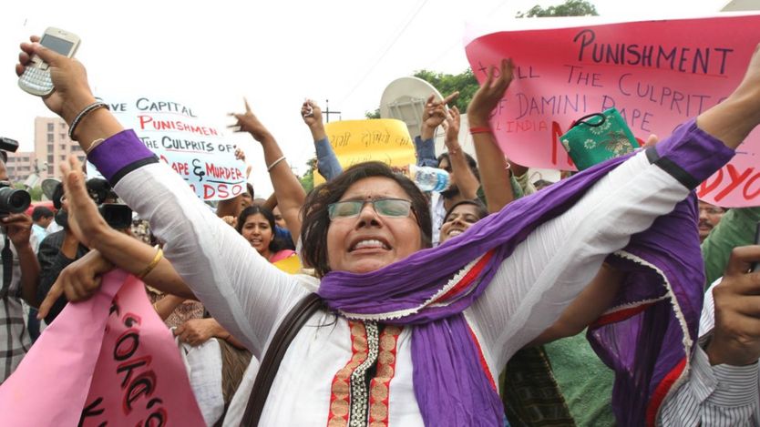 Women shout slogans outside the District court in Saket as they call for the death penalty of the four men convicted of rape and murder on September 13, 2013 in New Delhi, India